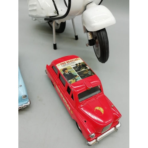 203 - 2 x Beatles Toy Cars with a Vespa.