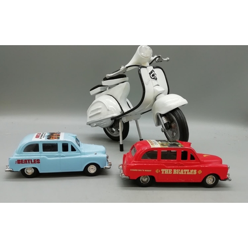 203 - 2 x Beatles Toy Cars with a Vespa.