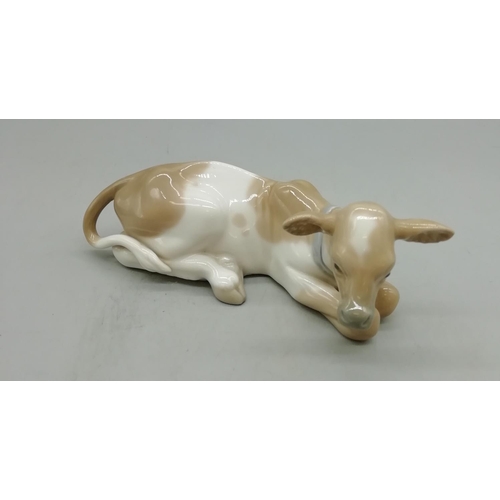 414 - Lladro Cow 4680. 17cm long, 7cm High.