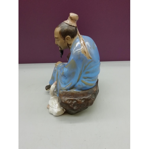 141 - Figure of a Seated Japanese Man with Goose. 16cm High.