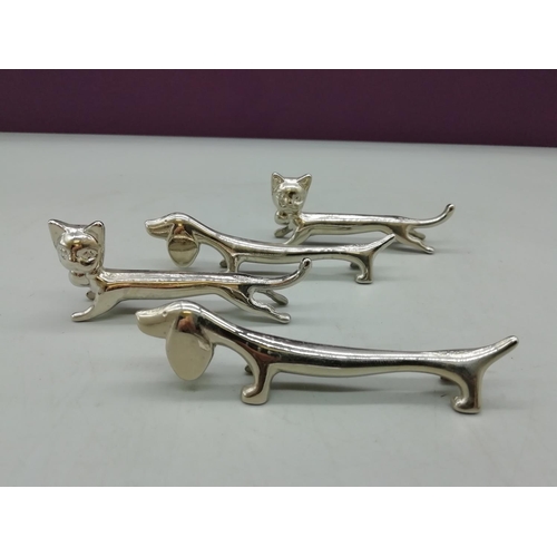 451 - White Metal Cat & Dog Shaped Knife Rests (4)