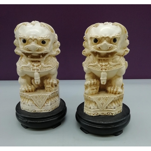 49 - Pair of Resin Foo Dogs on Stands. 15cm High.