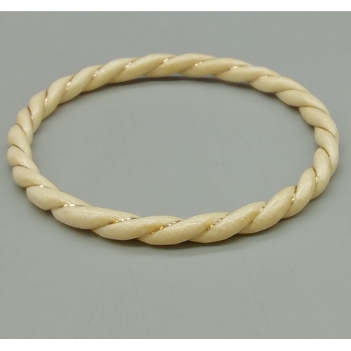 35 - 9ct Gold Inlaid Twisted Bangle.