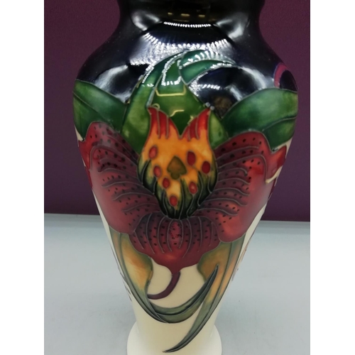 122 - Moorcroft 21cm Vase in the 'Anna Lily' Pattern by Nicola Slaney.