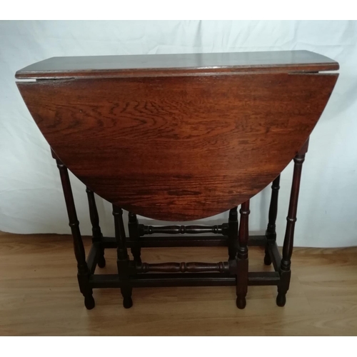 201 - Small Oak Spindle Table. 66cm High, 85cm Wide, 90cm Open. This Lot is Collection Only. All proceeds ... 