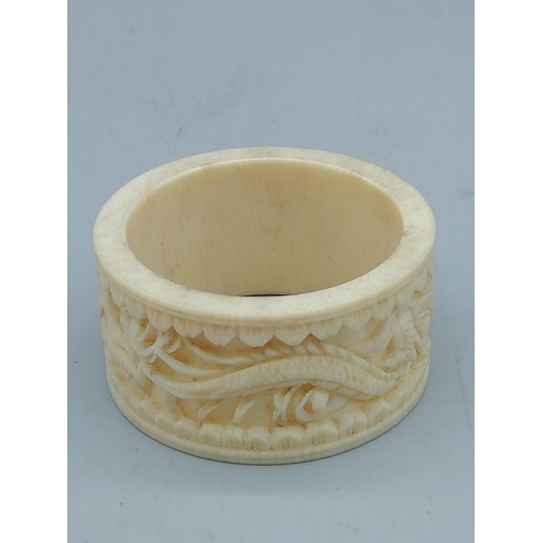 259 - Miniature Bone Ivory Buddha plus Carved Ivory Napkin Ring. All proceeds from this Lot to Centrepoint... 