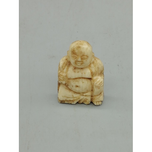 259 - Miniature Bone Ivory Buddha plus Carved Ivory Napkin Ring. All proceeds from this Lot to Centrepoint... 