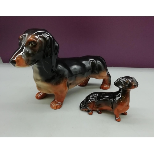 26 - Beswick Dachshunds (2). Large one A/F.