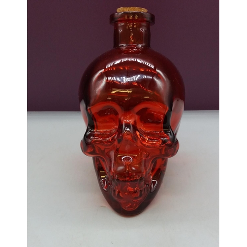 302 - Red Glass Skull Bottle. 17cm High.