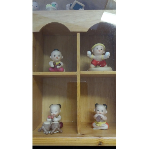 734 - Oriental Figures in Wooden House. 36cm High, 52cm Long.