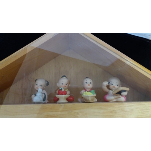 734 - Oriental Figures in Wooden House. 36cm High, 52cm Long.