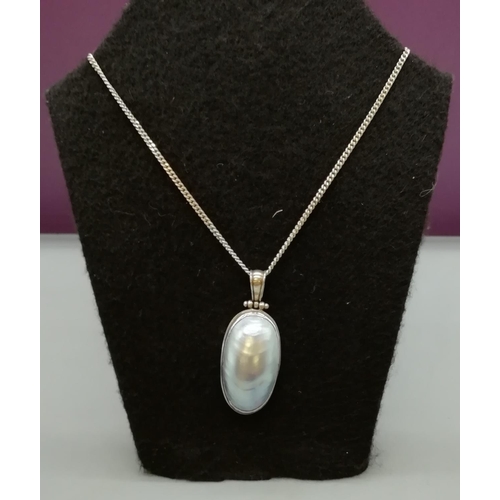 106 - 925 Silver and Mother of Pearl Pendant and Chain.