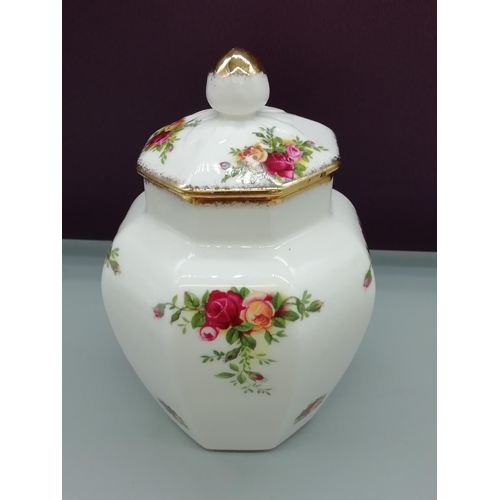 20 - Royal Albert Clock, Candlestick and Lidded Jar in the 'Old Country Roses' Pattern.