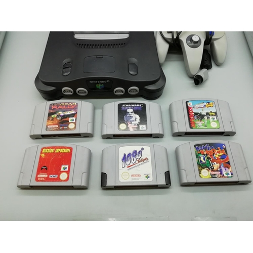 208 - Nintendo 64 plus 6 Games. Complete. W/O