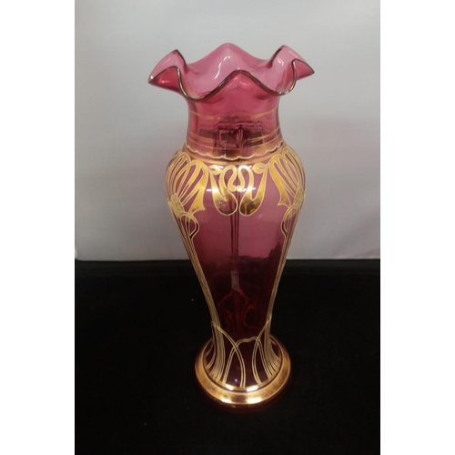 307 - c1900 Bohemian Art Nouveau Cranberry Blown Glass Fluted 34cm Vase. Nibbles to Rim.
