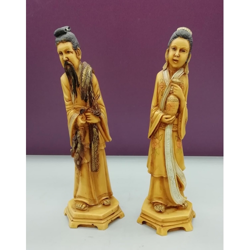 99 - Pair of Oriental Resin Figures. 21cm High.