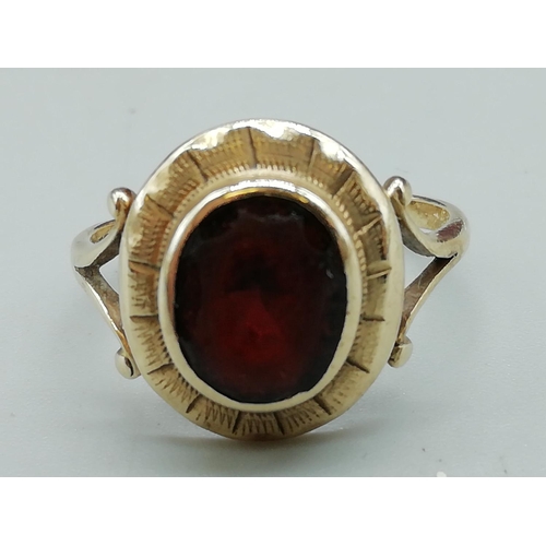 142 - Red Stone Set 9ct Hallmarked Ladies Ring. Size O. 3.49 Grams