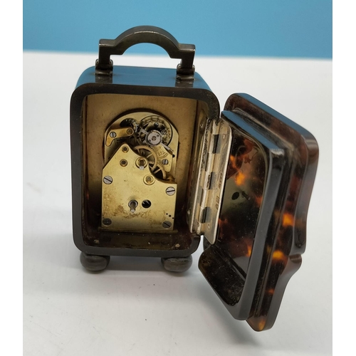 86 - Silver Hallmarked and Tortoise Shell Hinged 8 Day Clock with Key (1932). 7cm x 4cm. Needs Attention.