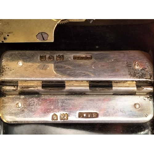 86 - Silver Hallmarked and Tortoise Shell Hinged 8 Day Clock with Key (1932). 7cm x 4cm. Needs Attention.