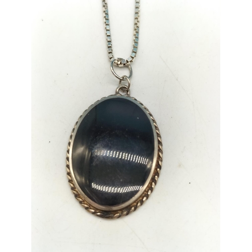 205 - Sterling Silver and Onyx Pendant and Chain. Hallmarked to Reverse.