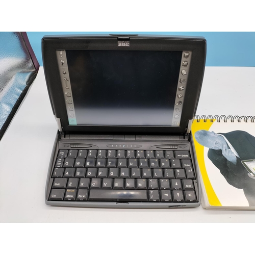 726 - Psion Series 7 Hand Held plus Book. Untested.