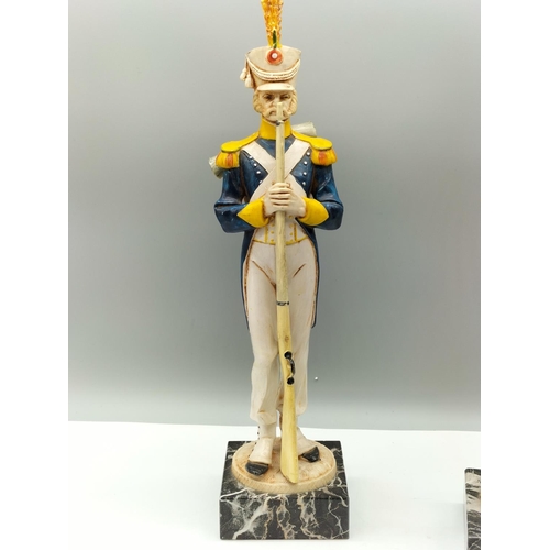 17 - Pair of Depose Soldier Figures on Carrara Marble Base. 36cm High.