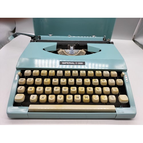 22 - Imperial 200 Light Blue Portable Typewriter.