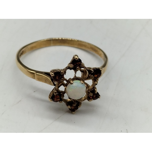 37 - 9ct Gold Ring set with Garnets and Opal. Hallmarked for Birmingham. Size P. All Stones Tested by Ven... 