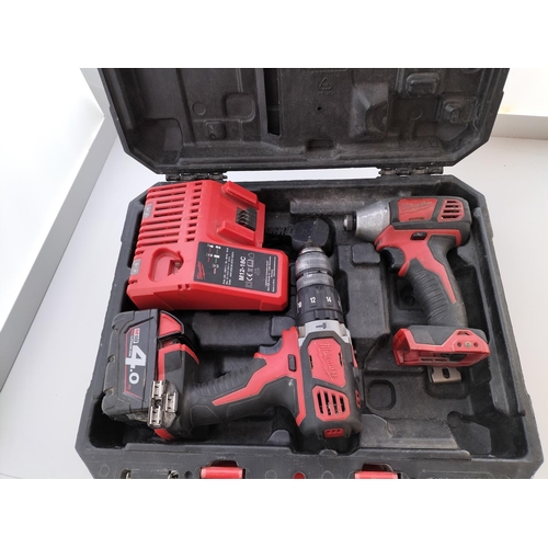 42 - Milwaukee Lithium-Ion Hammer Drill with Charger and Box W/O. Impact Wrench A/F.