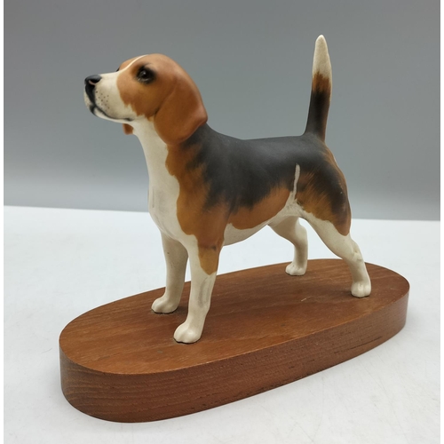 195 - Beswick Model of a Beagle on Plinth. 20cm x 15cm.