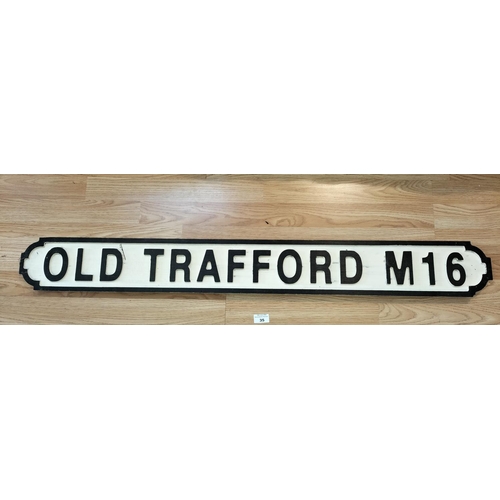 35 - Wooden 'Old Trafford M16' Sign. 117cm Long.