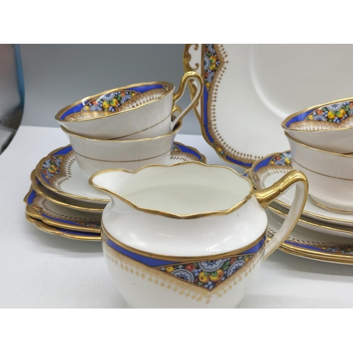 66 - Standard Bone China 21 Piece Tea Set to include Trios (6), Milk, Sugar and Bread and Butter Plate. 1... 