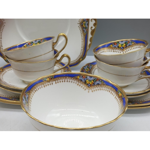 66 - Standard Bone China 21 Piece Tea Set to include Trios (6), Milk, Sugar and Bread and Butter Plate. 1... 