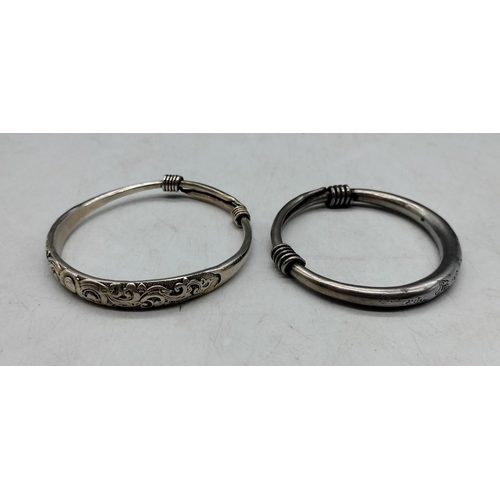 127 - 2 x White Metal Asian Bangles. One with Marks.