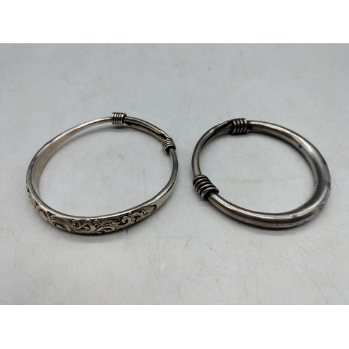 127 - 2 x White Metal Asian Bangles. One with Marks.