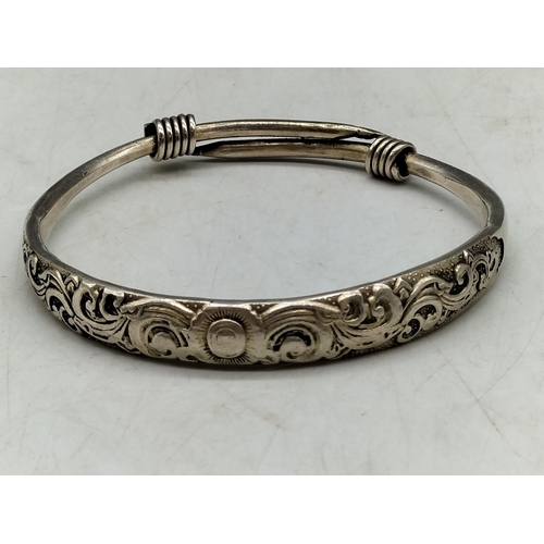 127 - 2 x White Metal Asian Bangles. One with Marks.