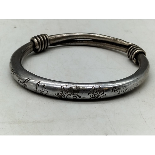 127 - 2 x White Metal Asian Bangles. One with Marks.