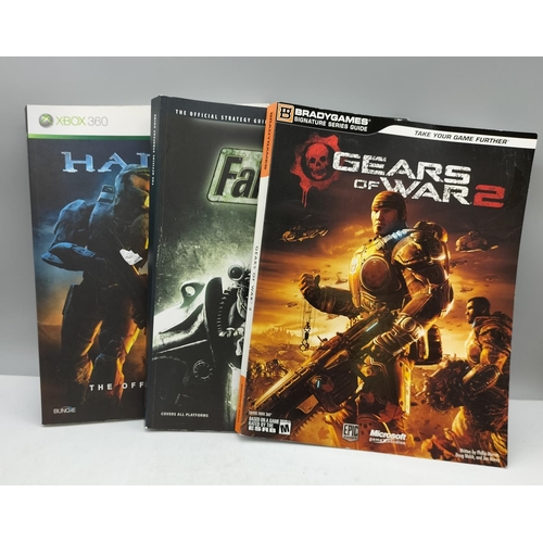 215A - 3 x Official Game Guides including 'Gears of War 2', 'Fallout 3' and 'X-Box Halo 3'.