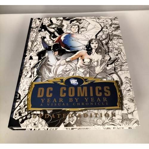 451 - 'DC Comics Year by Year, A Visual Chronicle'. Large Book complete with 2 Exclusive Prints.