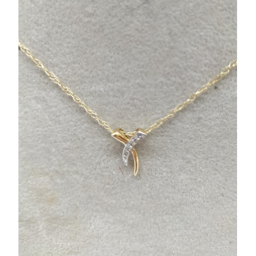 695 - 9ct Gold Diamond Chip Pendant and Chain.