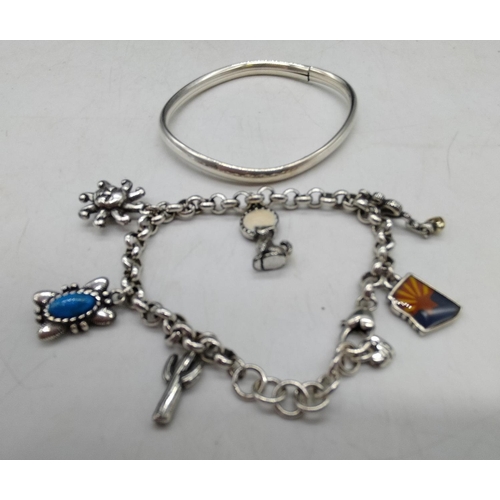 758 - 925 Silver Bangle plus White Metal Charm Bracelet.