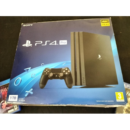 825A - Playstation PS4 Pro 1TB, Boxed with 2 x Games.