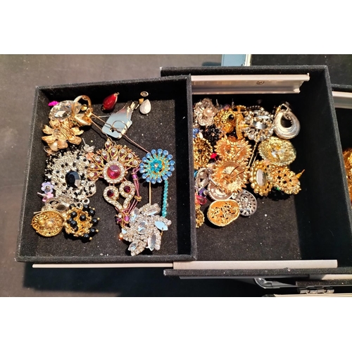 34 - Metal Case of Assorted Asian Costume Jewellery.