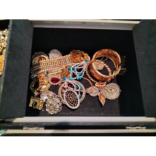 34 - Metal Case of Assorted Asian Costume Jewellery.