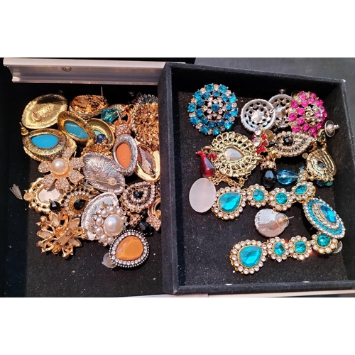 34 - Metal Case of Assorted Asian Costume Jewellery.