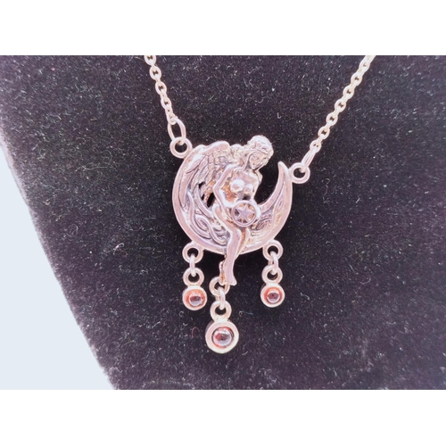 20 - 925 Silver Fairy Pendant set with Garnets.