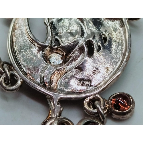 20 - 925 Silver Fairy Pendant set with Garnets.