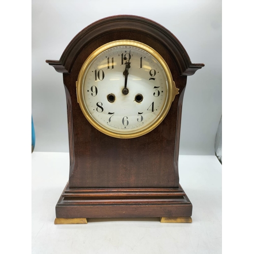 107 - Oak Cased Mantle Clock by Waterbury Clock Co, USA with Key and Pendulum W/O. 34cm High, 25cm x 14cm.