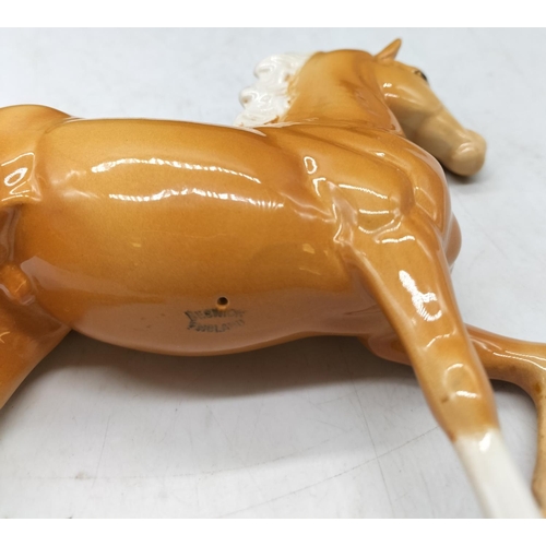 194 - Royal Doulton Figure of a Prancing Palomino Horse. 18cm x 18cm.