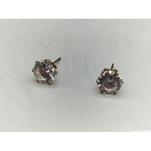 35 - 9ct Gold and Cubic Zirconia Earrings. 1.2 Grams. All Gold and Stones Tested by Vendor.